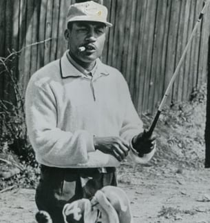 picture of golfer Charlie Sifford holding golf club